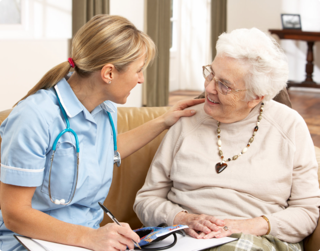 caregiver talking to an elder woman